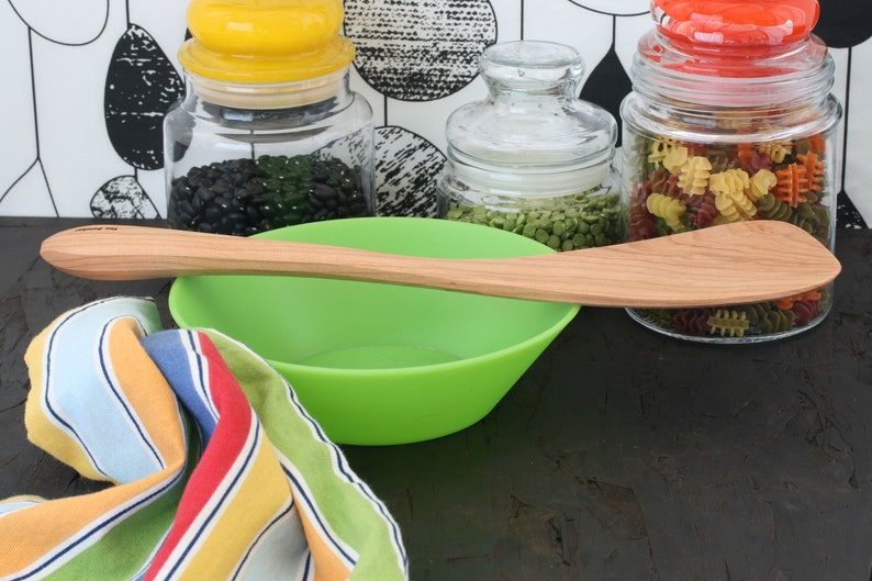 Wok spatula with a long handle available for chefs and cooks that are left or right handed Cherry wood cooking tool.