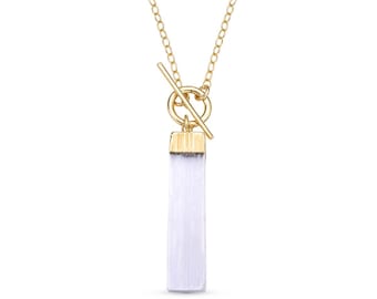 May include: A gold chain necklace with a white rectangular pendant and a gold toggle clasp.