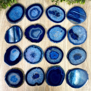 May include: Set of 16 blue agate coasters. Each coaster features a unique pattern of blue and white agate.