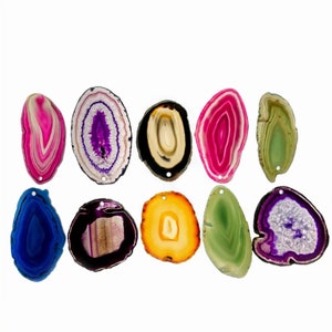 May include: Assortment of ten agate slices in various colors and patterns, including blue, green, purple, pink, and yellow. Each slice has a hole drilled through the top for hanging or crafting.