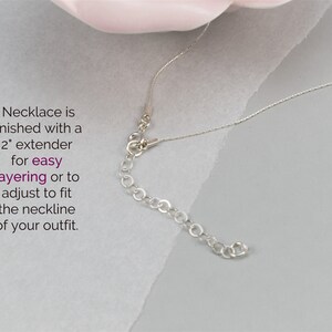 May include: Silver necklace with a 2 inch extender chain. Necklace is finished with a 2" extender for easy layering or to adjust to fit the neckline of your outfit.