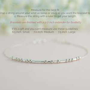 May include: A silver bracelet with small beads and bars. Instructions for measuring your wrist for the best fit are included. The bracelet is available in three sizes: 6.5 inches (small), 7.0 inches (medium), and 7.5 inches (large).