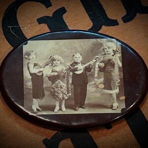 Rare circa 1930 celluloid pocket mirror of sideshow performers The Doll Family. ODDITIES