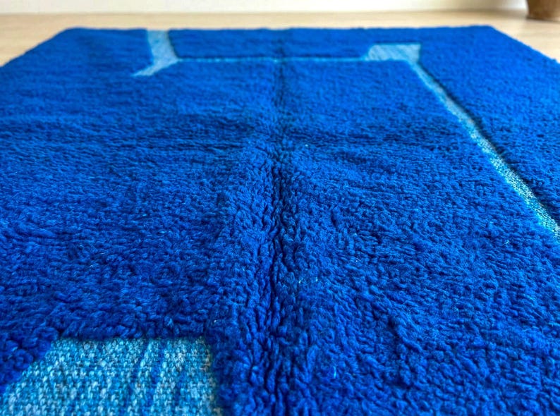 Blue Berber wool rug texture showing thick plush handmade fibers