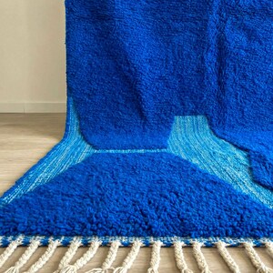 Close-up of blue Beni Ourain rug showing natural wool texture and artisan weaving