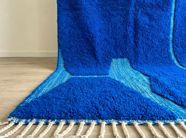 Close-up of blue Beni Ourain rug showing natural wool texture and artisan weaving