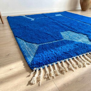 Handmade Moroccan rug detail with soft wool texture and tribal lines