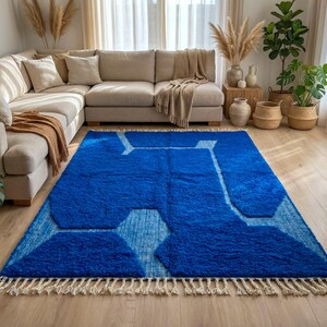 Blue Moroccan rug styled in modern living room with natural decor