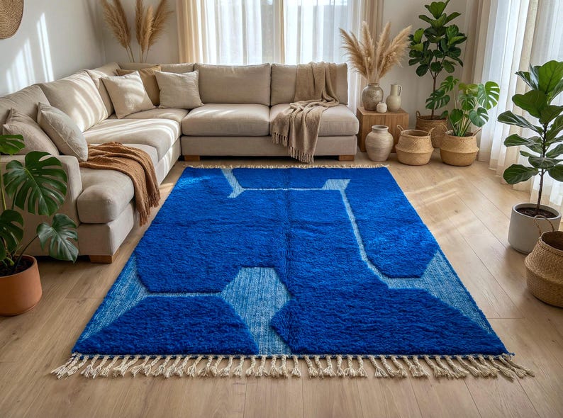 Blue Moroccan rug styled in modern living room with natural decor