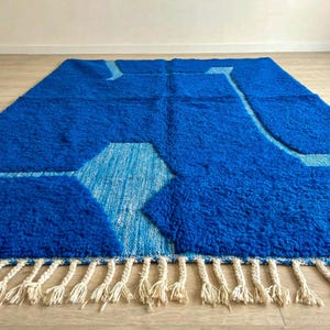 Blue Moroccan wool rug with abstract Berber design and thick handmade pile