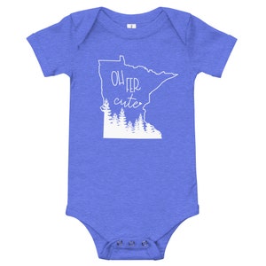 May include: A blue baby bodysuit with the phrase "Oh Fer Cute" in white script and a white outline of the state of Minnesota with a forest graphic. The bodysuit has short sleeves and snap closures.