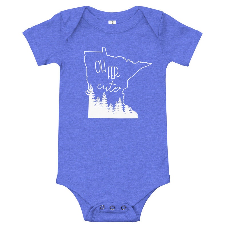 May include: A blue baby bodysuit with the phrase "Oh Fer Cute" in white script and a white outline of the state of Minnesota with a forest graphic. The bodysuit has short sleeves and snap closures.