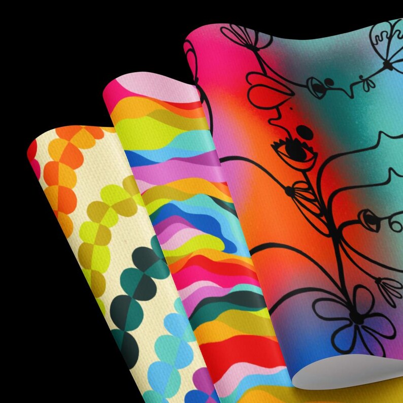May include: Three colourful wrapping paper designs. The first design features a pattern of overlapping circles in shades of yellow, orange, green, and blue. The second design features a pattern of wavy lines in shades of pink, blue, green, yellow, and red. The third design features a black and white illustration of a stylised flower with a gradient background in shades of blue, purple, pink, and orange.