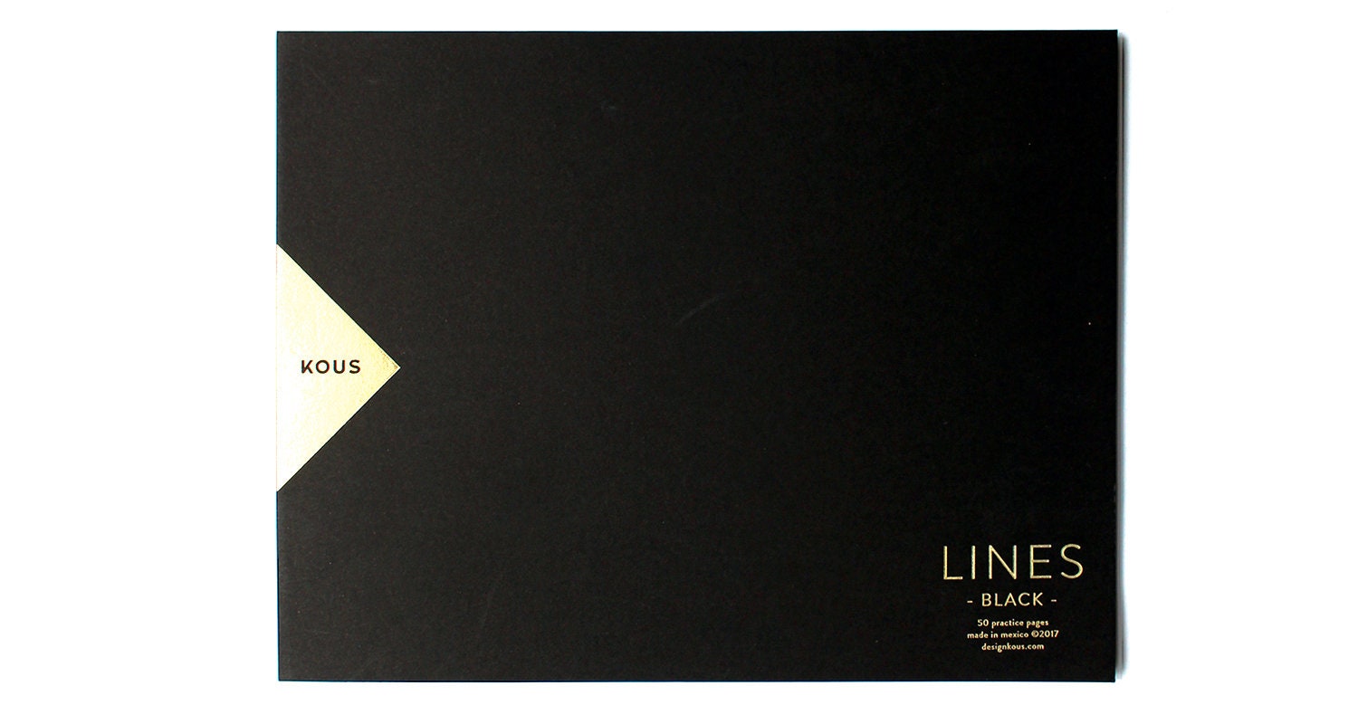 Calligraphy practice notepad with lined black pages
