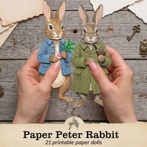 May include: Two paper rabbit dolls featuring detailed illustrations. One rabbit wears a blue jacket and holds a green radish, while the other wears a green coat, round glasses, and holds a brown pipe. The text reads Paper Peter Rabbit 21 printable paper dolls.
