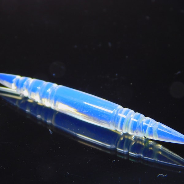 Rzeźbione kły z rogów opalowych - cena za sztukę