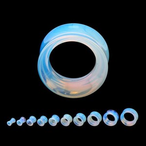 May include: A set of 10 opalite ear gauges in various sizes. The gauges are made of a translucent blue and white material with a smooth, polished finish.