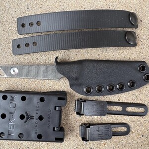 May include: A rustic wooden sign with the text "Welcome to our home" in white lettering. The sign features a distressed finish and a simple, inviting design, perfect for a front porch or entryway.