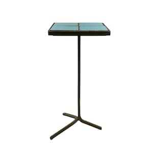 May include: A square side table with a teal tile top and a dark brown metal frame. The table has a single central support and a three-legged base. The top is divided into four teal squares.