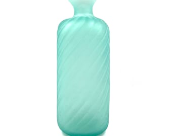 May include: A frosted glass vase with a light blue color and a twisted design.