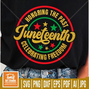 May include: A black t-shirt featuring a red, green and gold circular design. The circle contains the text "Honoring the Past Juneteenth Celebrating Freedom" and three stars. The text is in a gold glitter font.