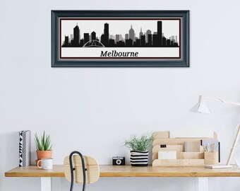 May include: Framed black and white Melbourne skyline art print. The cityscape silhouette includes iconic buildings and a bridge, set against a white background. The word "Melbourne" is printed below the skyline.