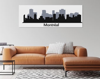 May include: A black and gray skyline silhouette of Montréal on a white background. The word "Montréal" is printed in black below the skyline. The artwork is displayed above a brown leather sofa with patterned pillows.