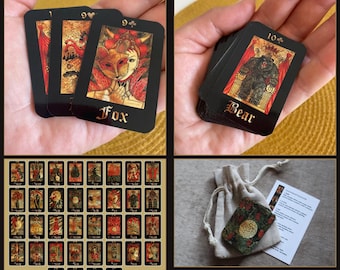May include: A 36-card Gothic Mini Lenormand divination deck featuring black-bordered cards with gold-toned illustrations. The set includes a small drawstring bag, a keyword brochure, and cards measuring 2.36 by 1.57 inches, displaying various symbolic imagery.