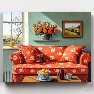 May include: A red floral patterned sofa with white cushions sits in a room with a window and a vase of orange roses. A table with a bowl of lemons, a mug, and a plate sits in front of the sofa.