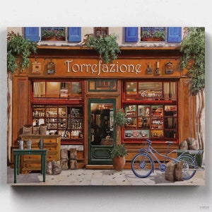 May include: A painting of a storefront with the words "Torrefazione" above the entrance. The shop has a red awning and a large window display filled with coffee beans and other goods. A bicycle is parked outside the shop, and there are bags of coffee beans on the sidewalk.