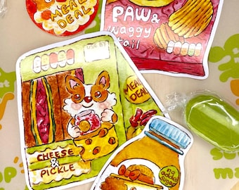 Könnte beinhalten: Eine Sammlung farbenfroher, illustrierter Aufkleber mit Cartoon-Tieren und Lebensmitteln. Designs umfassen eine Chipstüte, eine Flasche Orangensaft und ein Menüangebot mit Text.