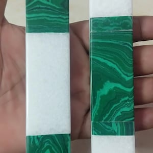 May include: Two rectangular green and white marble door handles. The handles are labeled 1 and 2.