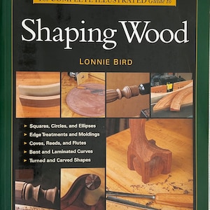 May include: Book cover for "The Complete Illustrated Guide to Shaping Wood" by Lonnie Bird. The cover displays wood shaping techniques, including squares, circles, ellipses, edge treatments, and curved shapes, with a green border.