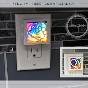 May include: A white night light with a colorful heart and paw print design. The night light is plugged into a wall outlet. The image also includes the text "STL & 3MF FILES + COMMERCIAL USE".