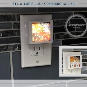 May include: A white night light with a monster truck design plugged into a wall outlet. The night light has a square frame with a colorful, abstract background. The text "STL & 3MF FILES + COMMERCIAL USE" is at the top.