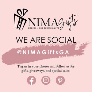 May include: A pink and white graphic with the text "NIMAGifts" in black, followed by "MODERN + CHIC CURATED GIFTS" in smaller black text. The graphic also includes a black and white illustration of a gift box with a bow. The text "WE ARE SOCIAL" is in black and the text "@NIMAGifts GA" is in black. The graphic also includes social media icons for Facebook, Instagram, and Pinterest.