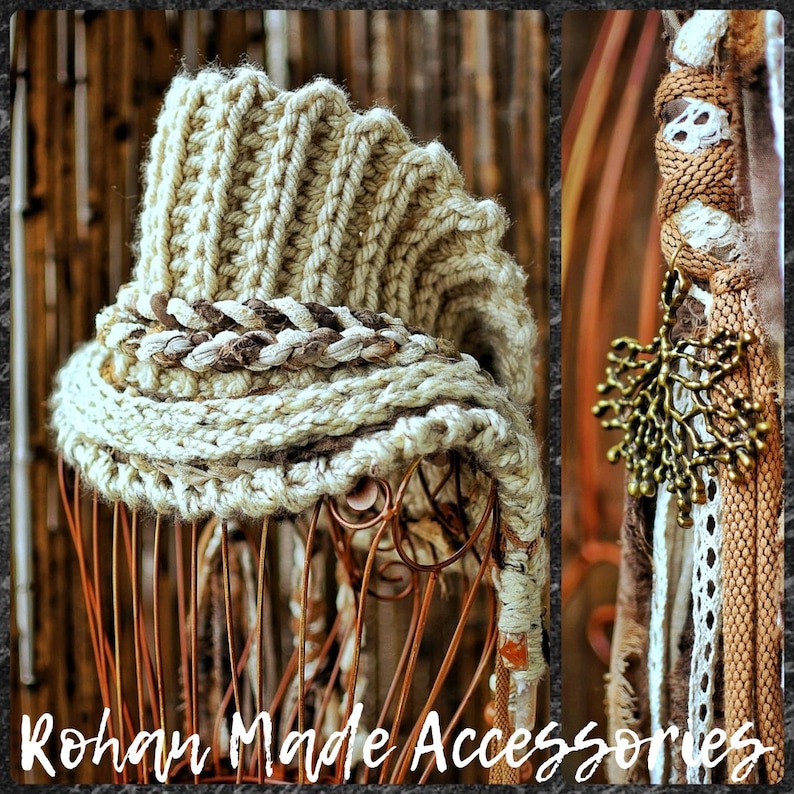 May include: A beige knit hat with a ribbed texture and a braided trim, featuring a dangling metallic tree-shaped charm attached to a side panel of woven cords, lace, and fabric strips. The text Rohan Made Accessories is visible.