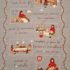 May include: A colorful cross-stitch sampler depicting a woman's week of embroidery. Each day of the week is illustrated with a different scene of the woman embroidering. The text reads "La semaine de la Broderise" and "et maintenant... un autre projet".