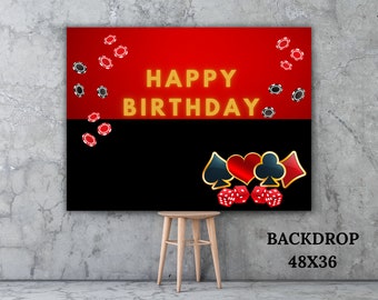 May include: A red and black casino themed backdrop with the text "Happy Birthday" in gold. The backdrop features playing card suits, dice, and poker chips. The backdrop is 48 inches by 36 inches.