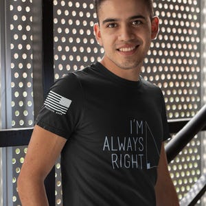 May include: A black t-shirt with a white American flag patch on the left sleeve and the text "I'm Always Right" in white with a small geometric design.