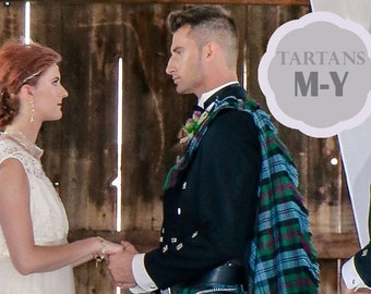 May include: A wedding ceremony with a groom wearing a traditional Scottish kilt and a green, blue, and black tartan plaid. The groom is holding hands with the bride, who is wearing a white wedding dress. The text "TARTANS M-Y" is visible in the background.