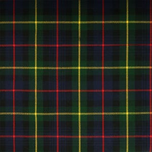 May include: A green, yellow, and red plaid fabric with a repeating pattern.