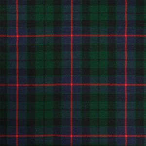 May include: A green, blue, and red tartan fabric with a repeating plaid pattern.