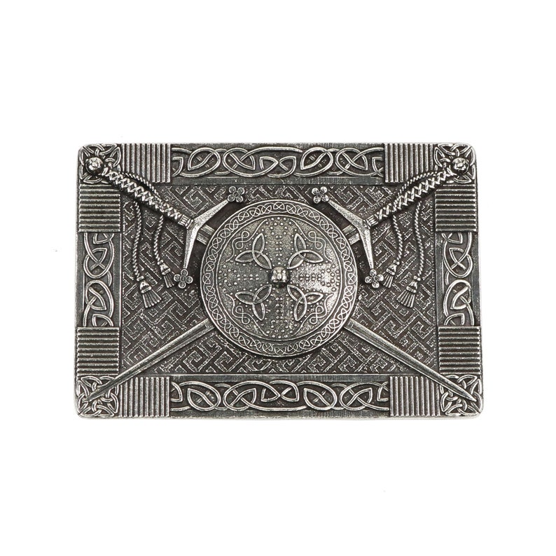 May include: A silver metal belt buckle with a Celtic knot design and two crossed swords with a shield in the center.