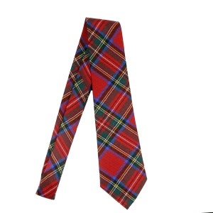 May include: A red, blue, green and yellow plaid tie. The tie is folded in half and the wide end is pointing down.