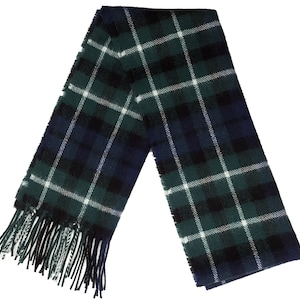 May include: A green, blue, and white plaid scarf with fringe on the ends.