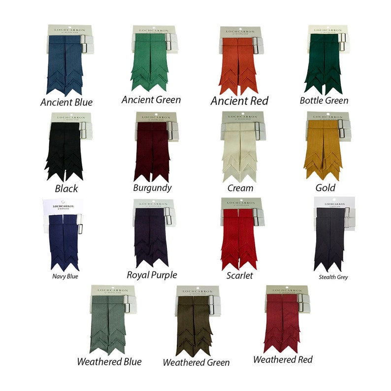 May include: A set of 14 kilt hose flashes in various colors, including ancient blue, ancient green, ancient red, bottle green, black, burgundy, cream, gold, navy blue, royal purple, scarlet, stealth grey, weathered blue, and weathered green. Each flash is packaged on a card with the brand name "Lochcarron" printed on it.