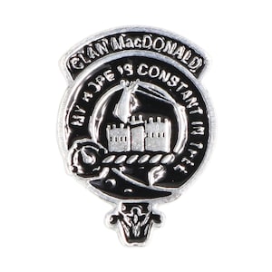 May include: A silver Clan MacDonald crest pin with a black enamel background. The crest features a castle with three towers and a rope tied around the base. The text "Clan MacDonald My Hope Is Constant In Thee" is inscribed around the crest.