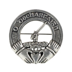 May include: Silver-toned metal clan crest with a heart, two hands, a dagger, and the text "O'Dochartaigh".