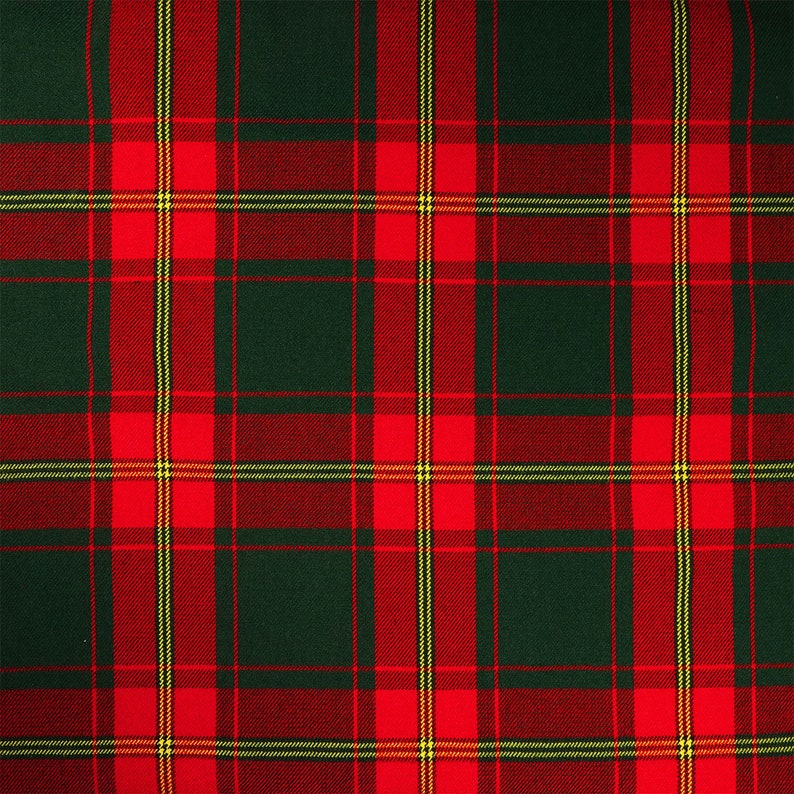 May include: A red and green plaid fabric with a subtle yellow stripe. The fabric has a woven texture.